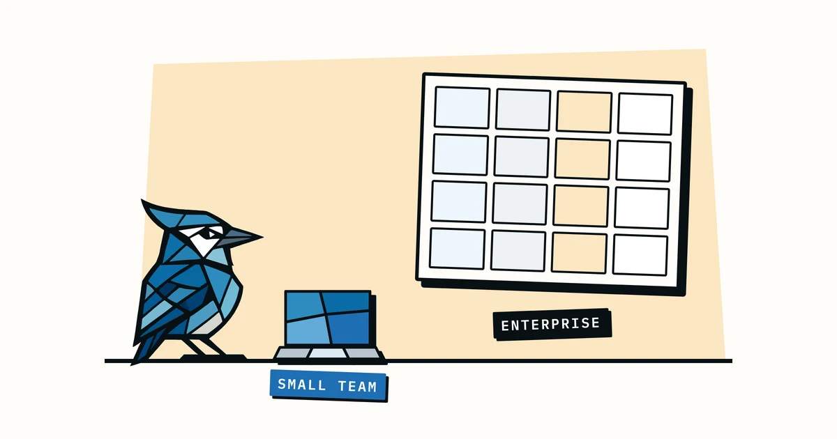 Jay the blue jay next to a small laptop labelled 'small team' and a crowded dashboard labelled 'enterprise'