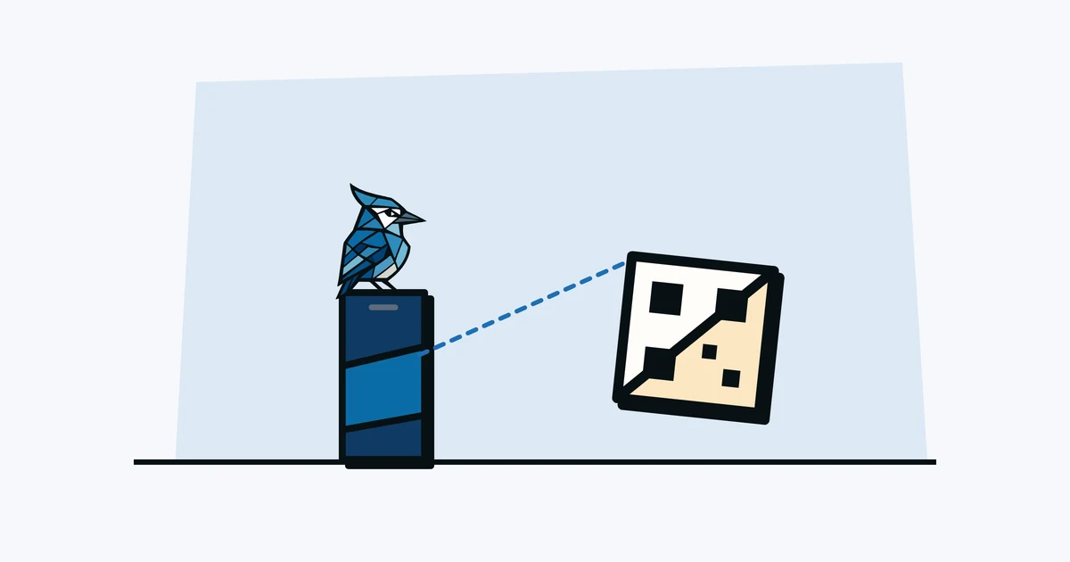 Jay the blue jay standing on a phone that is scanning a large QR asset tag